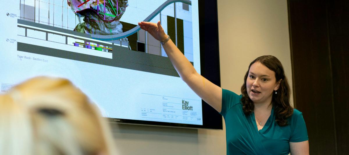 Woman delivering corporate presentation on smart television technology