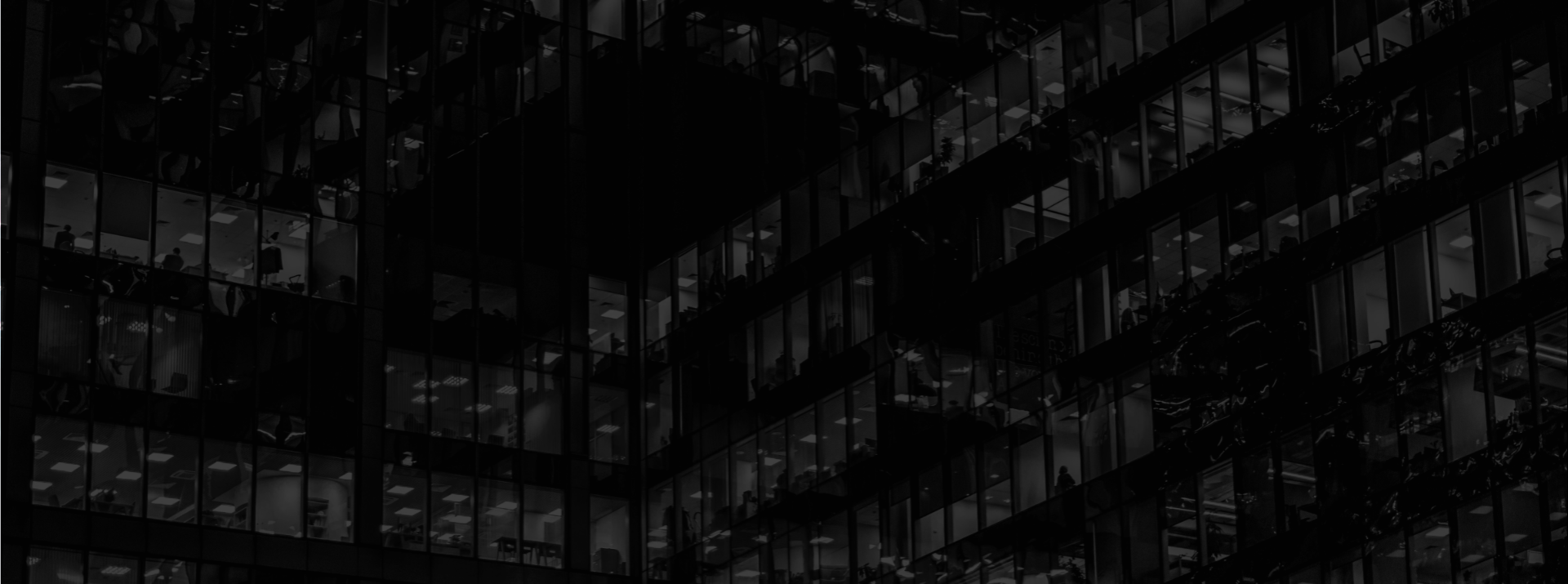 Black and grey abstract image of an office building.
