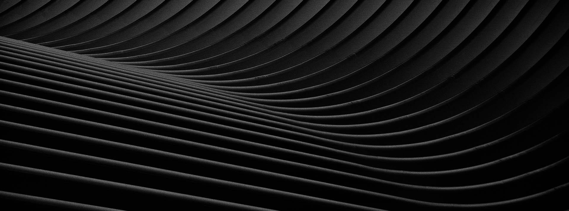 Black and white curved lines with shadowing.